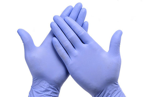 Hands in latex gloves