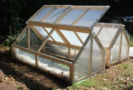 Greenhouse made of film on a wooden frame